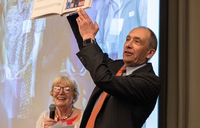 Seattle University Board of Trustees member Brenda Christensen gifted Joe with a book of anecdotes and memories from various people