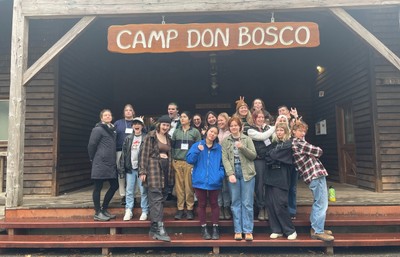 Students standing outside retreat center called camp don bosco