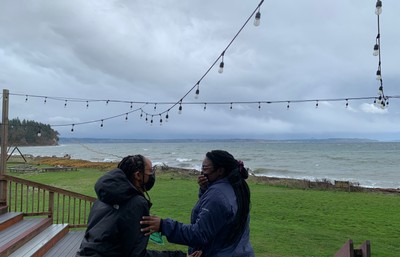 students in front of ocean