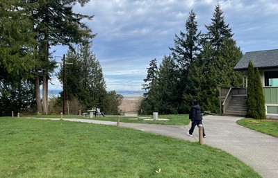 Someone walking on a path outside retreat center