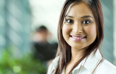 A woman against a green background