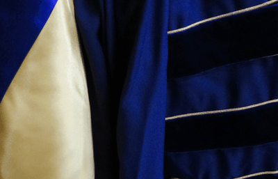 Close-up of blue academic robes