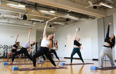 Students doing yoga in an extended lunge