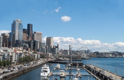 A city with boats in water.