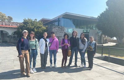 SU Students posing infront of a building