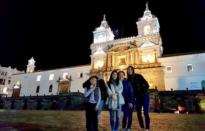 Students in Spain in front of brightly lit castle