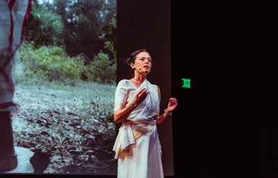 Doshi speaking from stage