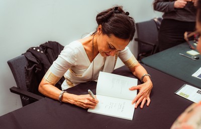 Doshi signing books