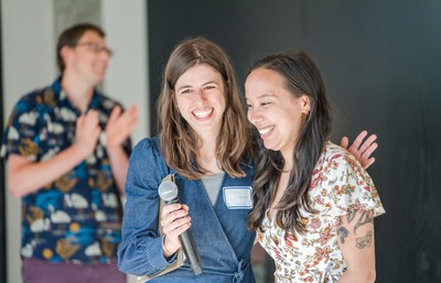 Student and Faculty Smiling while student is presented award