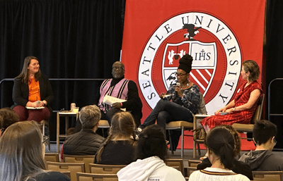 From left to right. Doctor Hilary Hawley from English, Doctor Saheed Adejumobi from History, Doctor Nnedi Okorafor, and Doctor Yen-Lin Han from Mechanical Engineering engaged in a panel discussion on stage in Campion Ballroom.