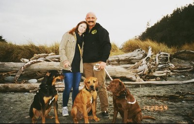 A couple and three dogs