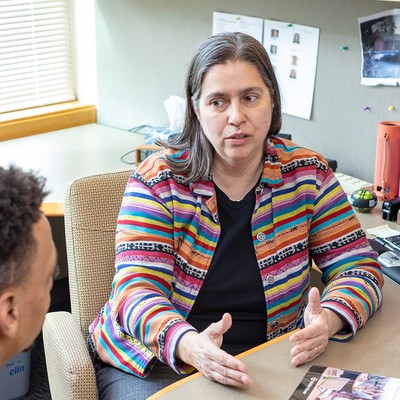 Professor Paula Enguidanos working with a law student