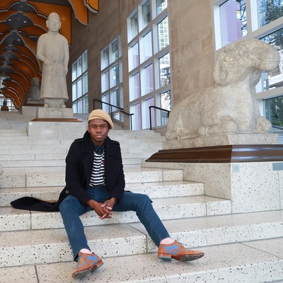 Student sitting on a marble staircase