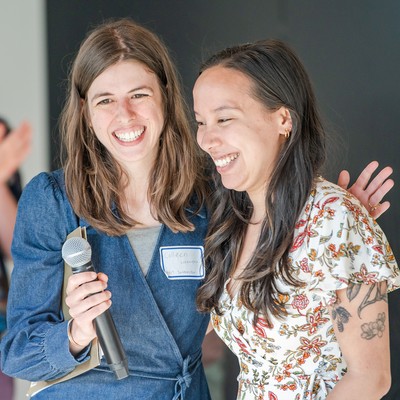 Two students smiling together