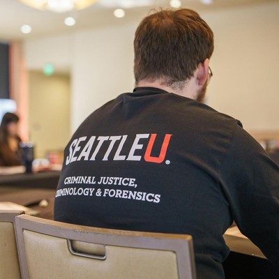 A student wearing a SU Criminoology shirt