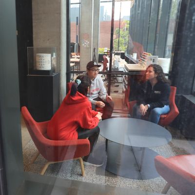Students seated around a low table