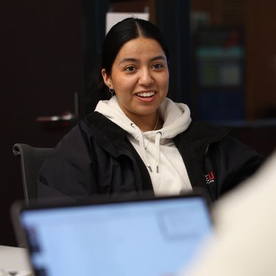 Student talks to a classmate