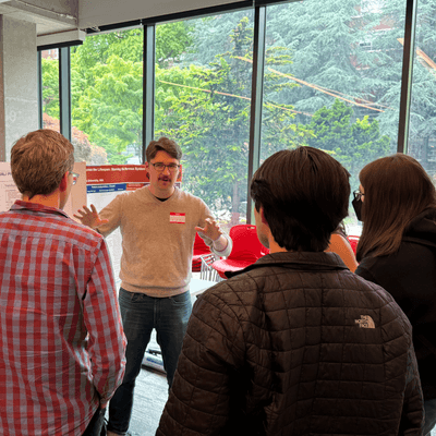 Students watch teacher explaining concept