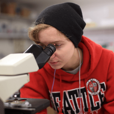 Student Uses Microscope