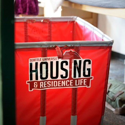 Red moving cart that says Housing and Residence Life