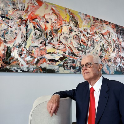 Bill Hedreen in front of donated painting