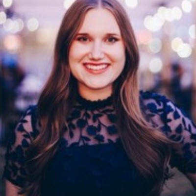 Samantha Anderson with painted wall in background