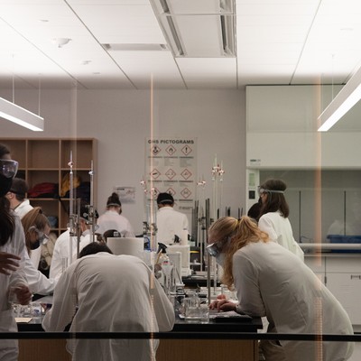 A group of people working in a lab.