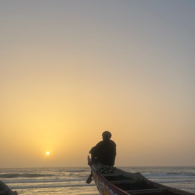 a person sits on a dock