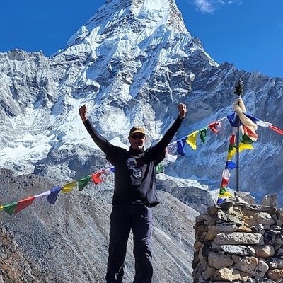 Dr. Tom Taylor in front of Mount Everest