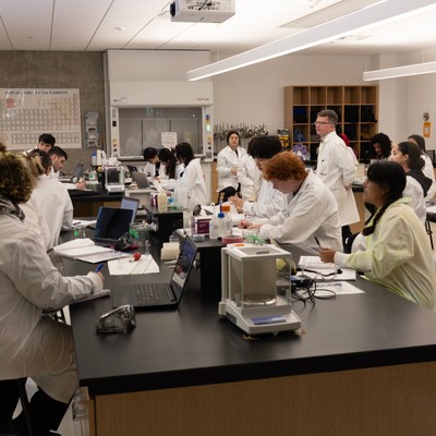 Students in Lab Coats in a Classroom