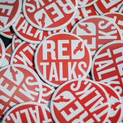 A pile of Red Talks buttons.