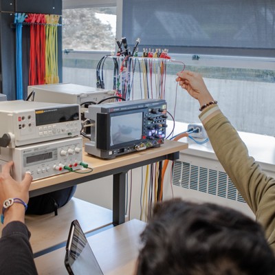 Electrical and computer engineering students working with electrical equipment