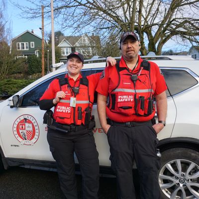 2 DPS officers with white nissan rogue