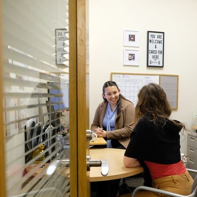 Student meeting with advisor in the office
