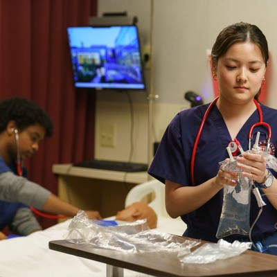 Two students practice skills