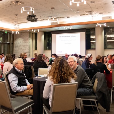 Photo of students and alumni networking