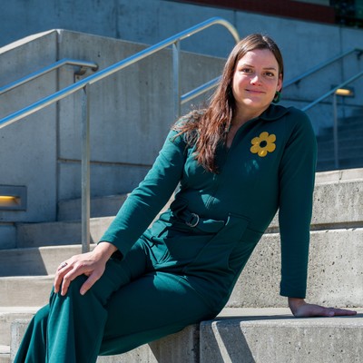 Maria Gotay smiling sitting on campus