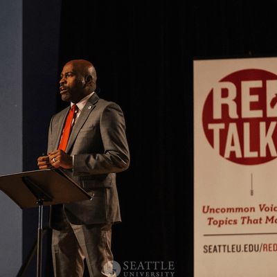 Alvin Sturdivant speaking on a stage.