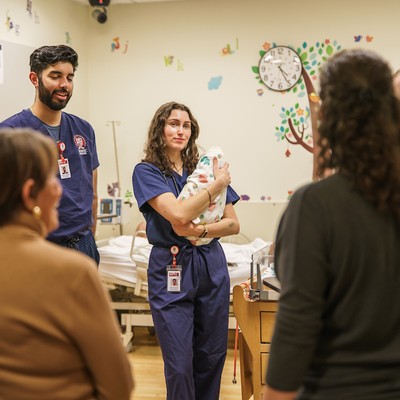 Photo of students in clinical setting