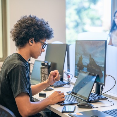 High school student working at computer