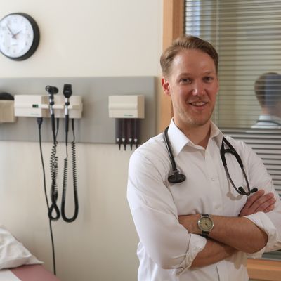 A person in a clinical setting with a stethoscope