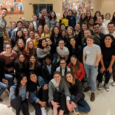 A large group of students attending christian student welcome dinner