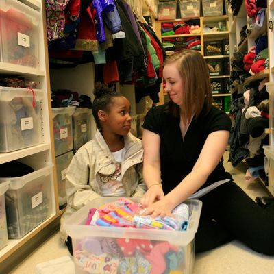 Alum Samantha Stork working with child at First Place