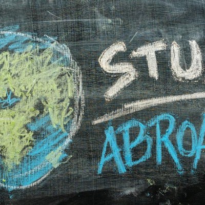 Chalkboard drawing of a globe and the words study abroad