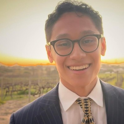 Smiling man in front of sunset