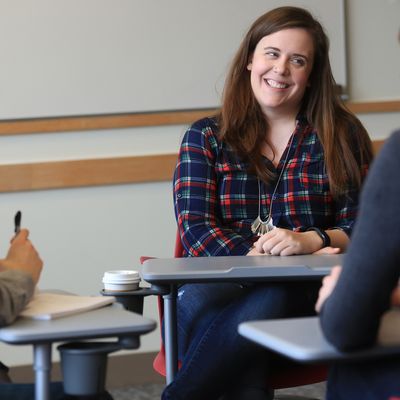 A group of graduate students in a small group class