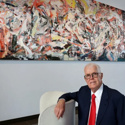 Richard Hedreen smiling in front of painting