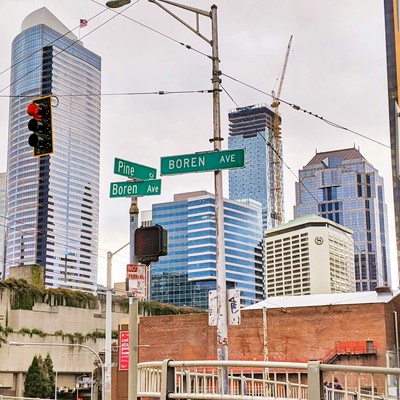 Pike and Boren street signs against Seattle building backdrop