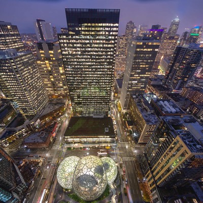 Amazon headquarters in the midst of Seattle buildings at night