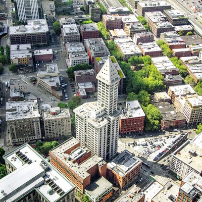 Aerial view of Smith Tower surrounded by buildings in Seattle